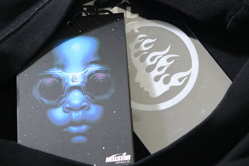 Hellstar Helmet and Cracked Lightning Graphic T-Shirt — hang_tag