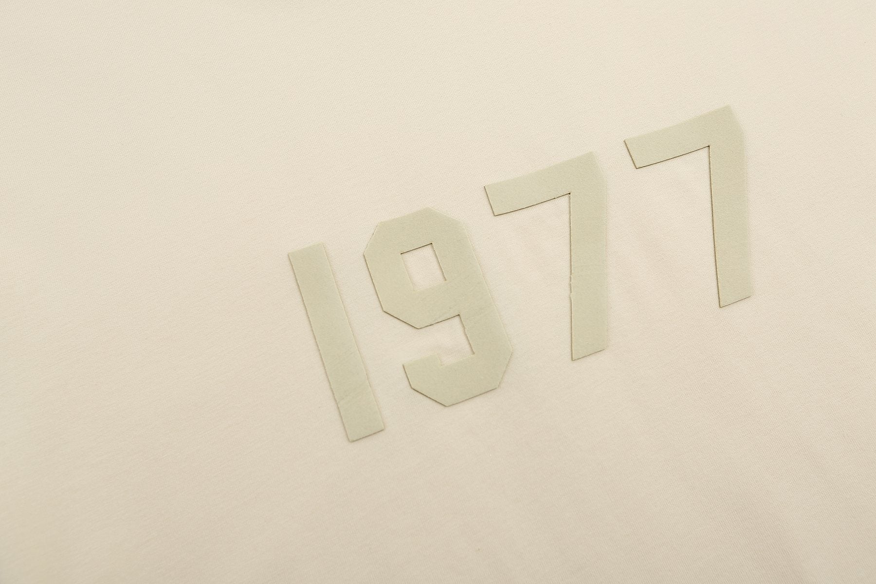 ESSENTIALS 1977 Tonal Wordmark Mock-Neck T-Shirt — detail