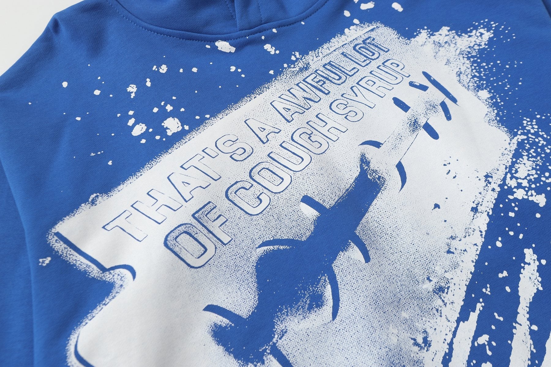 THAT'S A AWFUL LOT OF COUGH SYRUP Star Graphic Pullover Hoodie — detail