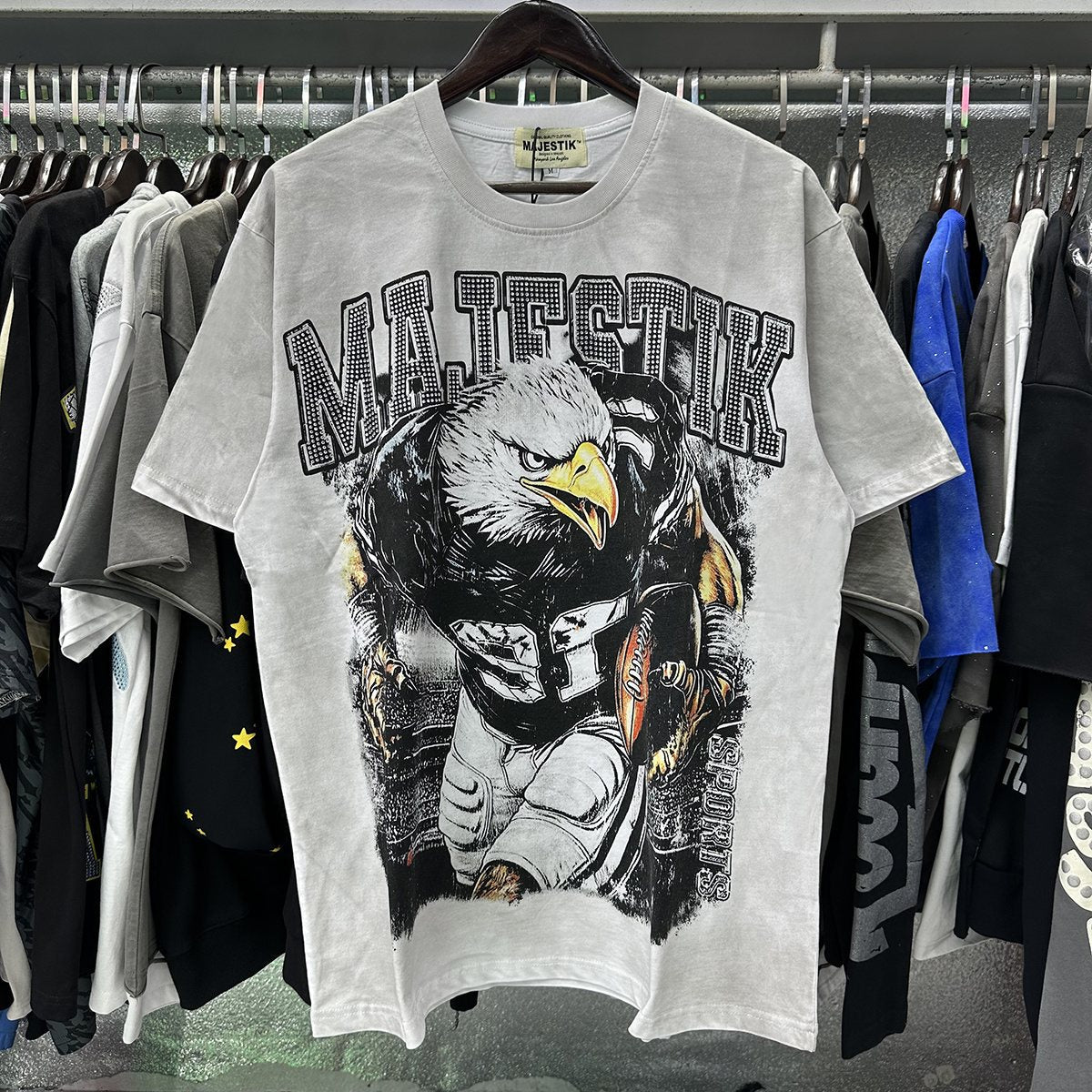 MAJESTIK Eagle Football Rhinestone Graphic T-Shirt — context