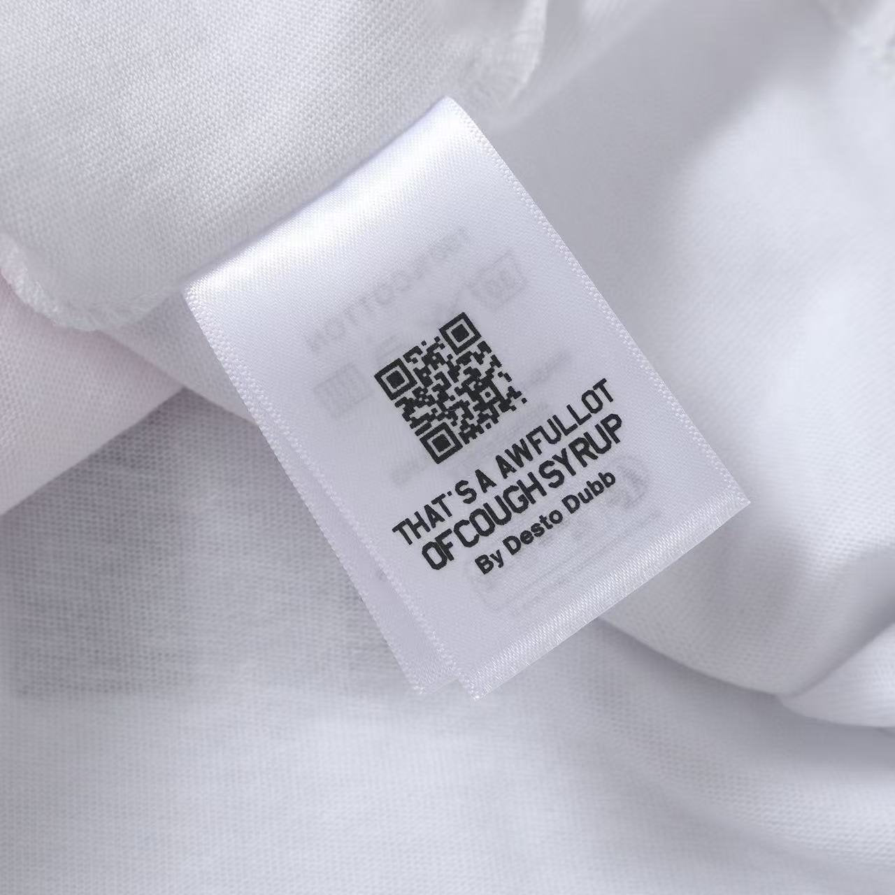 THAT'S A AWFUL LOT OF COUGH SYRUP Front & Back Graphic Short-Sleeve T-Shirt — neck_label