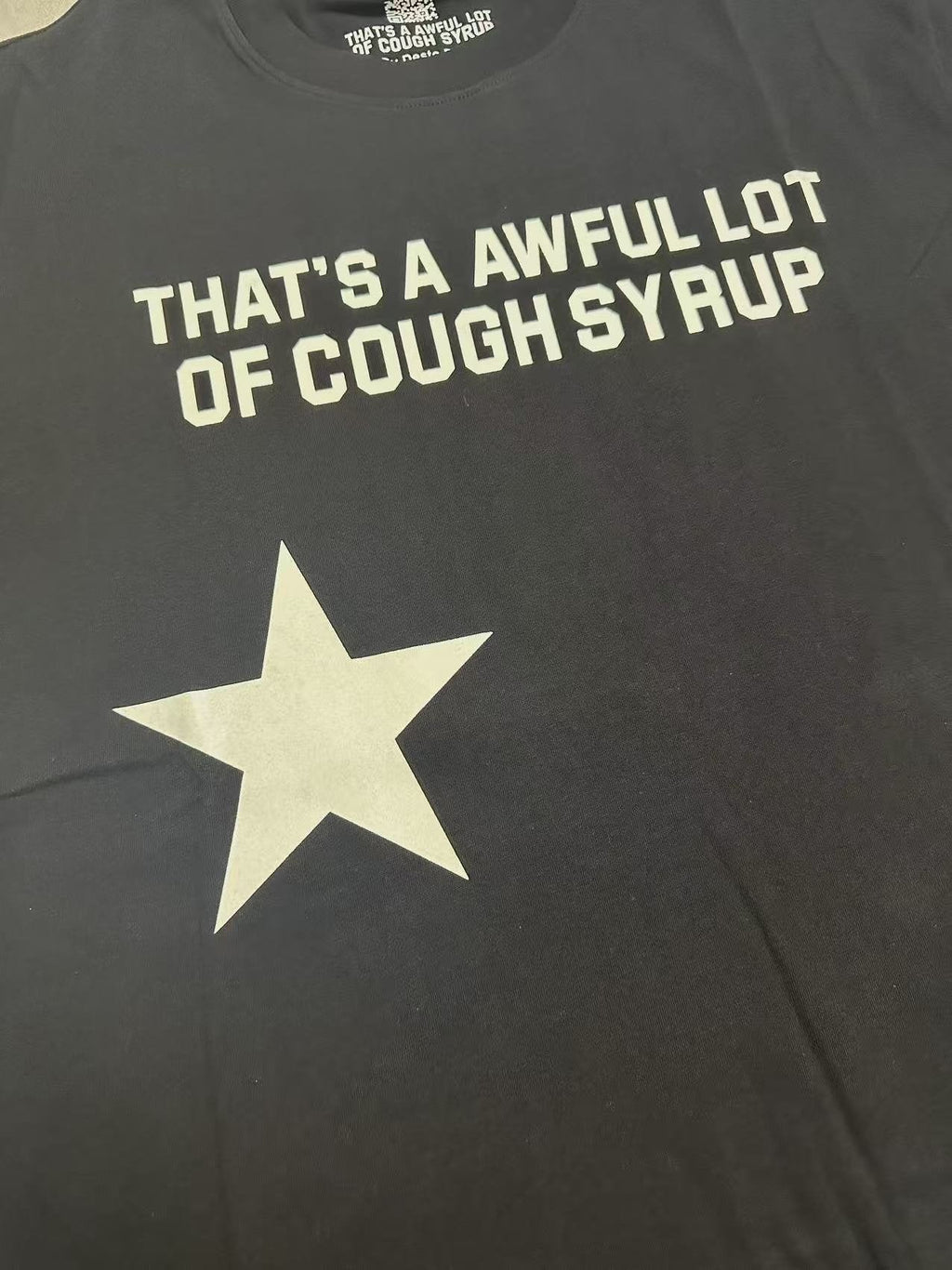 THAT'S A AWFUL LOT OF COUGH SYRUP Star Graphic Short-Sleeve T-Shirt — detail