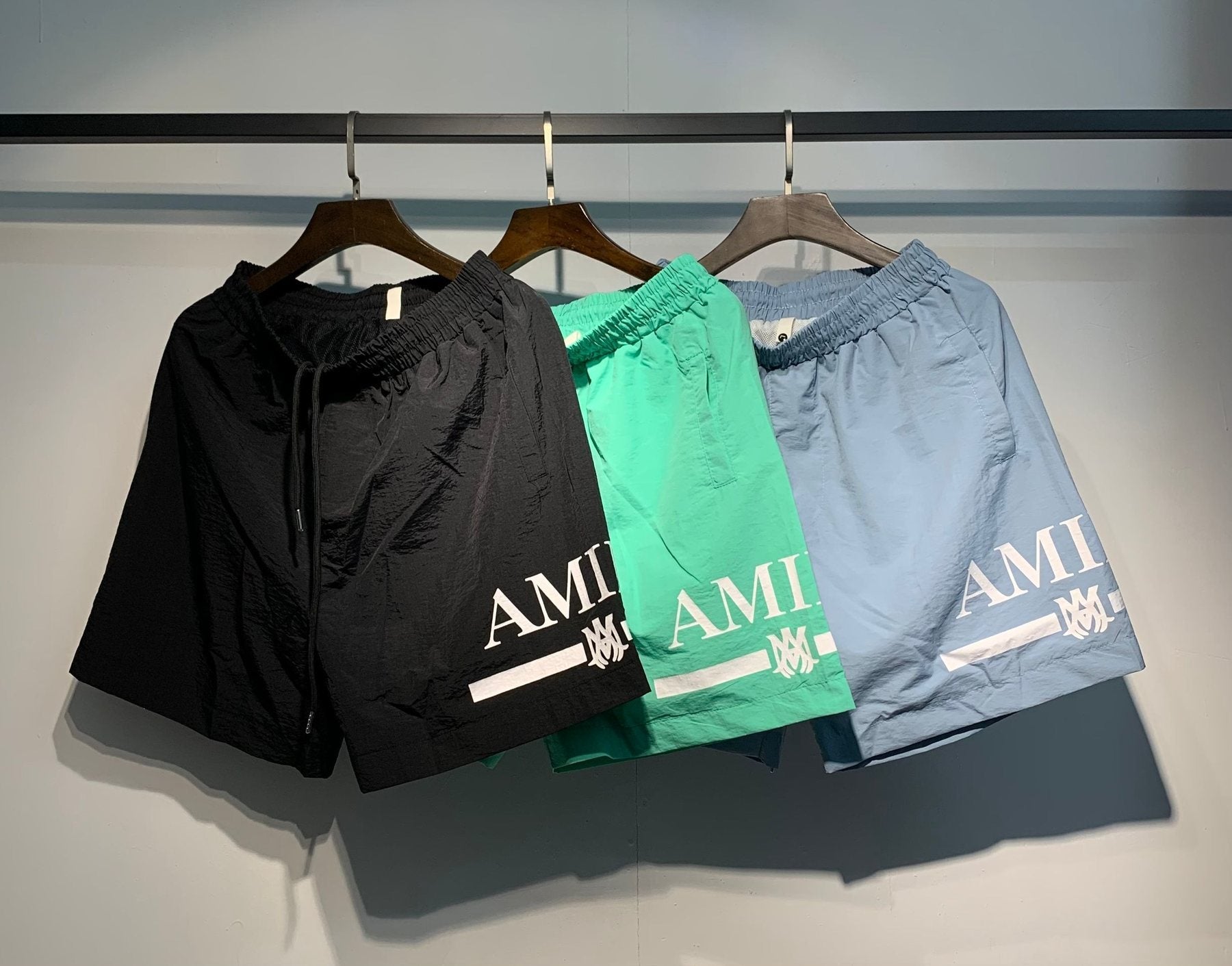 AMIRI Logo Graphic Shorts — comparison
