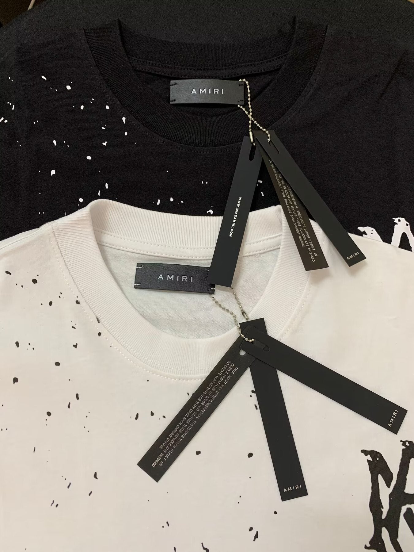 AMIRI Paint Splatter Graphic T-Shirt — hang_tag