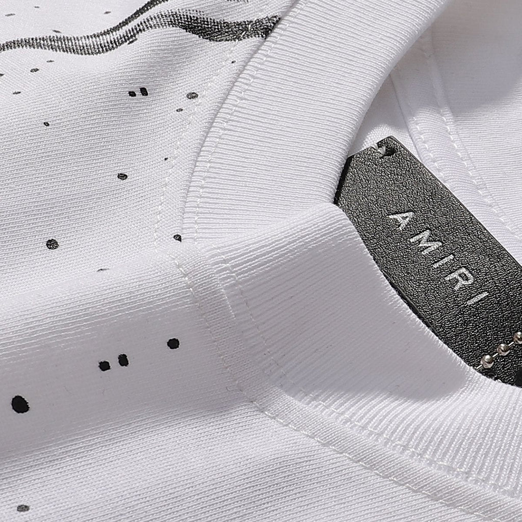 AMIRI Los Angeles Paint-Splatter Graphic T-Shirt — neck_label