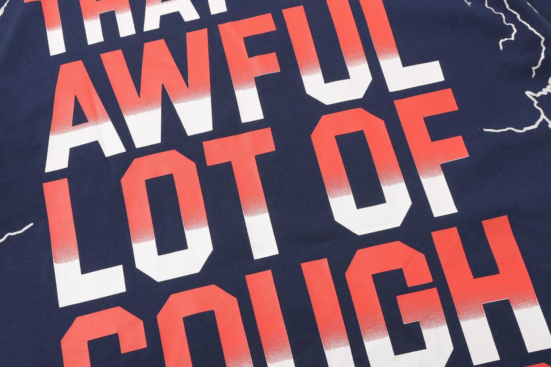 THAT'S A AWFUL LOT OF COUGH SYRUP Lightning Cartoon Graphic T-Shirt — detail