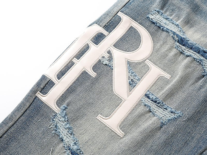 AMIRI Light Blue Distressed Letter Graphic Jeans — detail