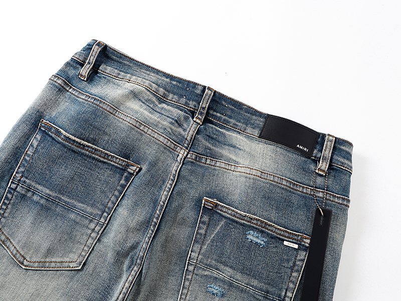 AMIRI Light Blue Distressed Letter Graphic Jeans — detail
