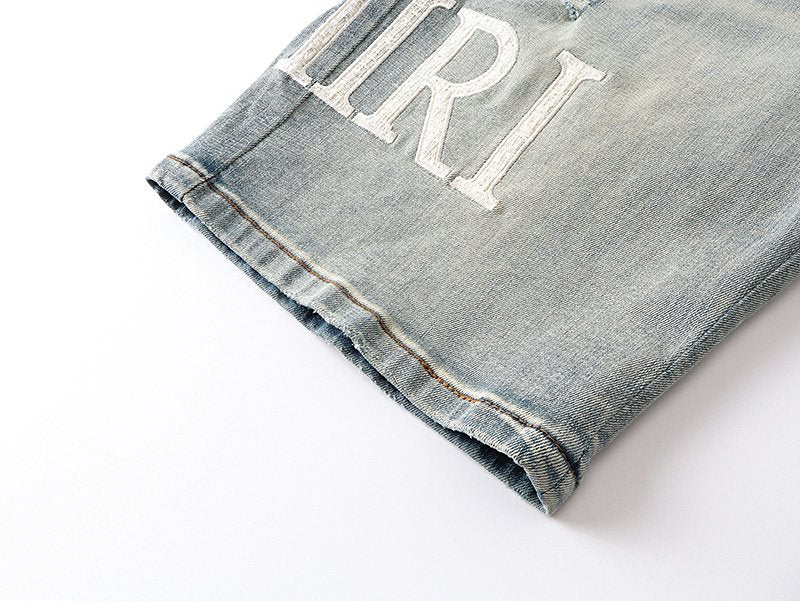 AMIRI Light Blue Distressed Denim Shorts — detail