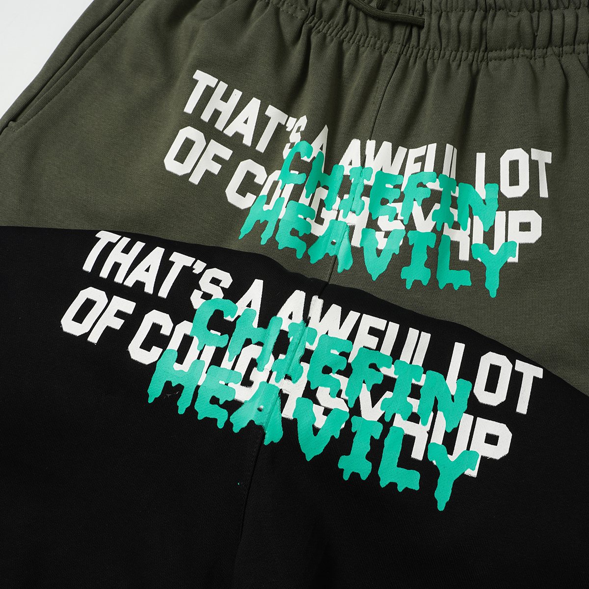 THAT'S A AWFUL LOT OF COUGH SYRUP Drawstring Graphic Shorts — detail