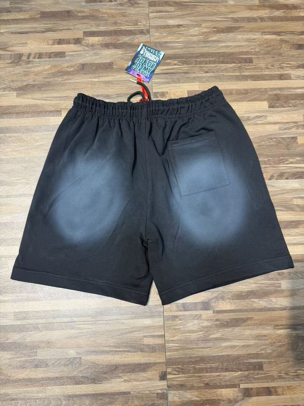 THAT'S A AWFUL LOT OF COUGH SYRUP Black Front Graphic Shorts — back