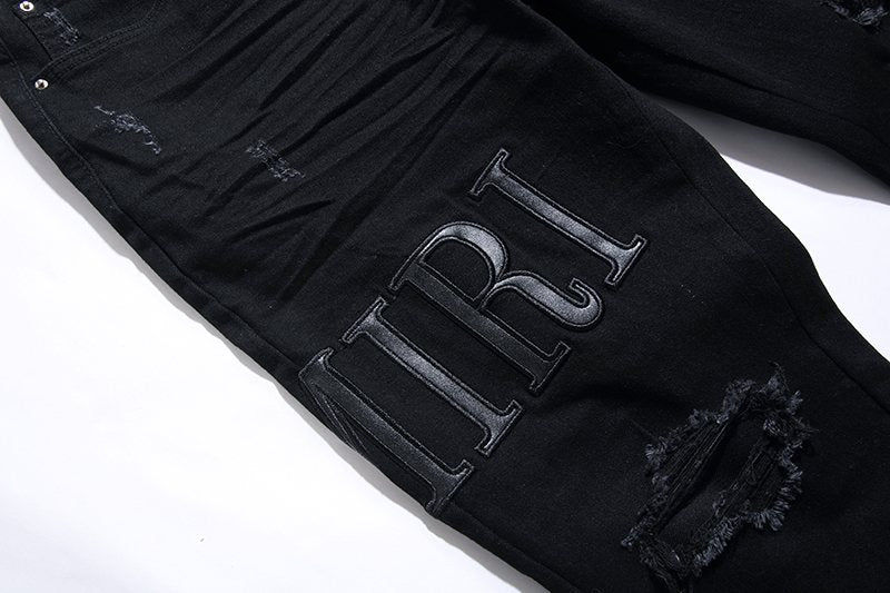 AMIRI Black Distressed Lettering Jeans — detail