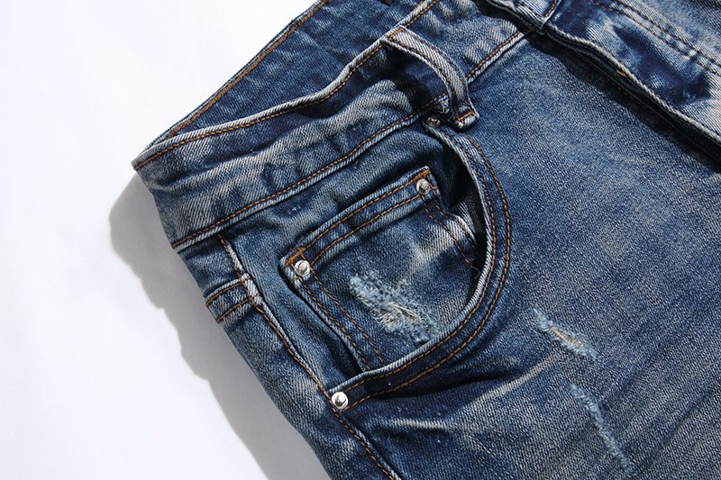 AMIRI Blue Washed Embroidered Jeans — detail
