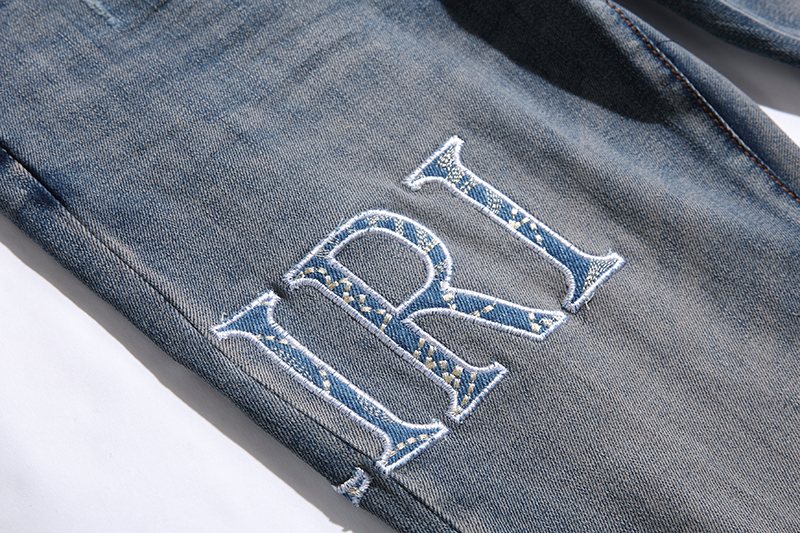 AMIRI Blue Washed Embroidered Jeans — detail