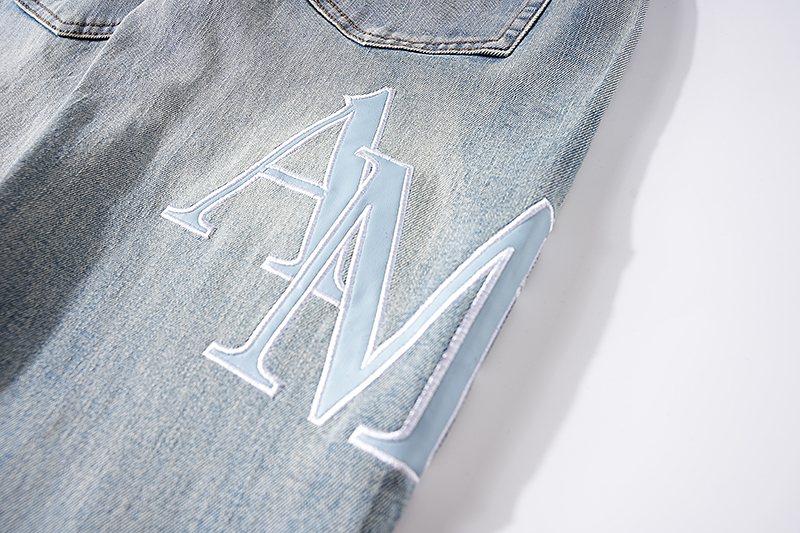 AMIRI Light Blue Letter Graphic Distressed Jeans — detail