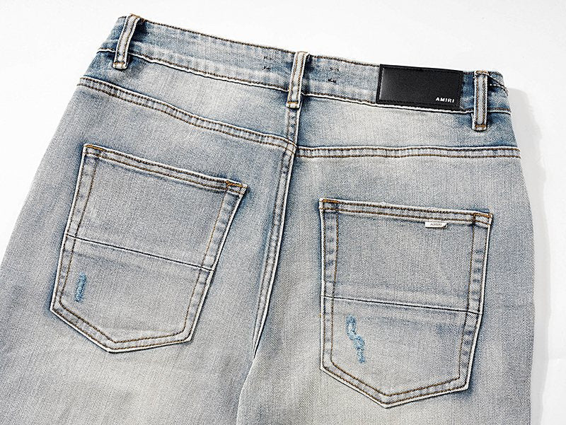 AMIRI Light Blue Distressed Ripped Knee Jeans — detail