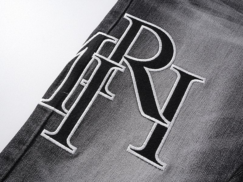 AMIRI Washed Black Embroidered Jeans — detail