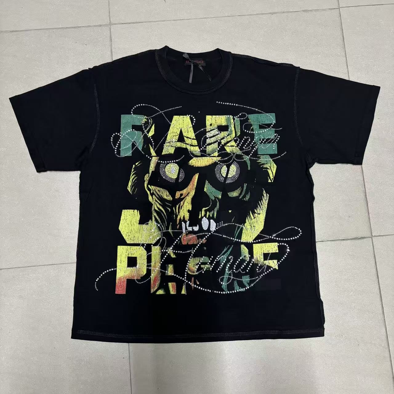 RARE PEACE Save Our Souls Skull Graphic T-Shirt — front
