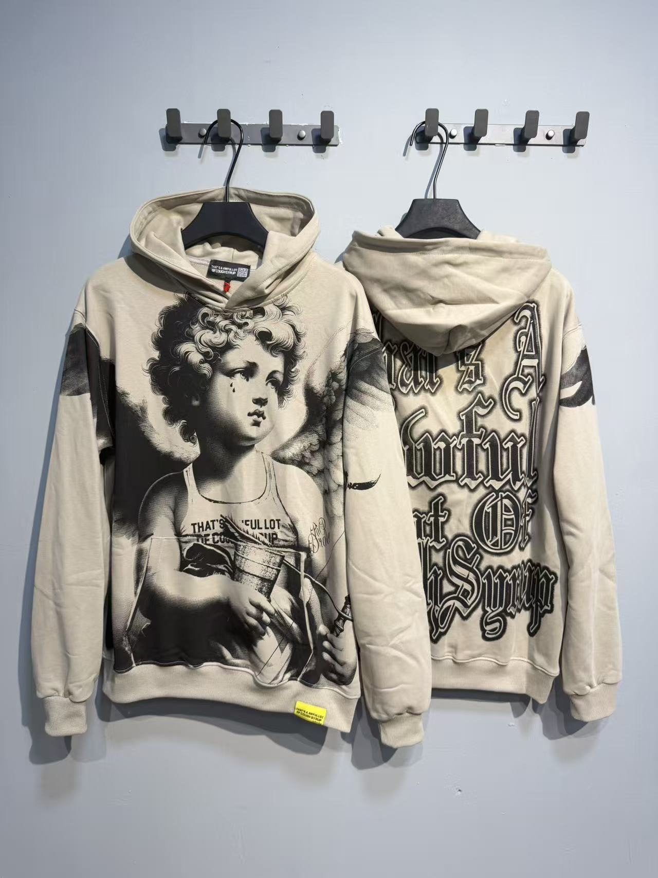 THAT'S A AWFUL LOT OF COUGH SYRUP Angel Graphic Hoodie — context