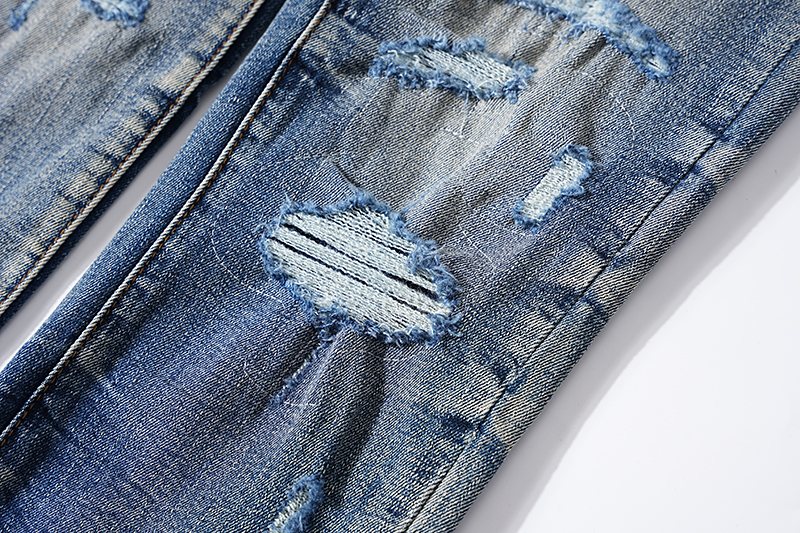 Amiri Varsity Letter Patch Distressed Jeans — detail