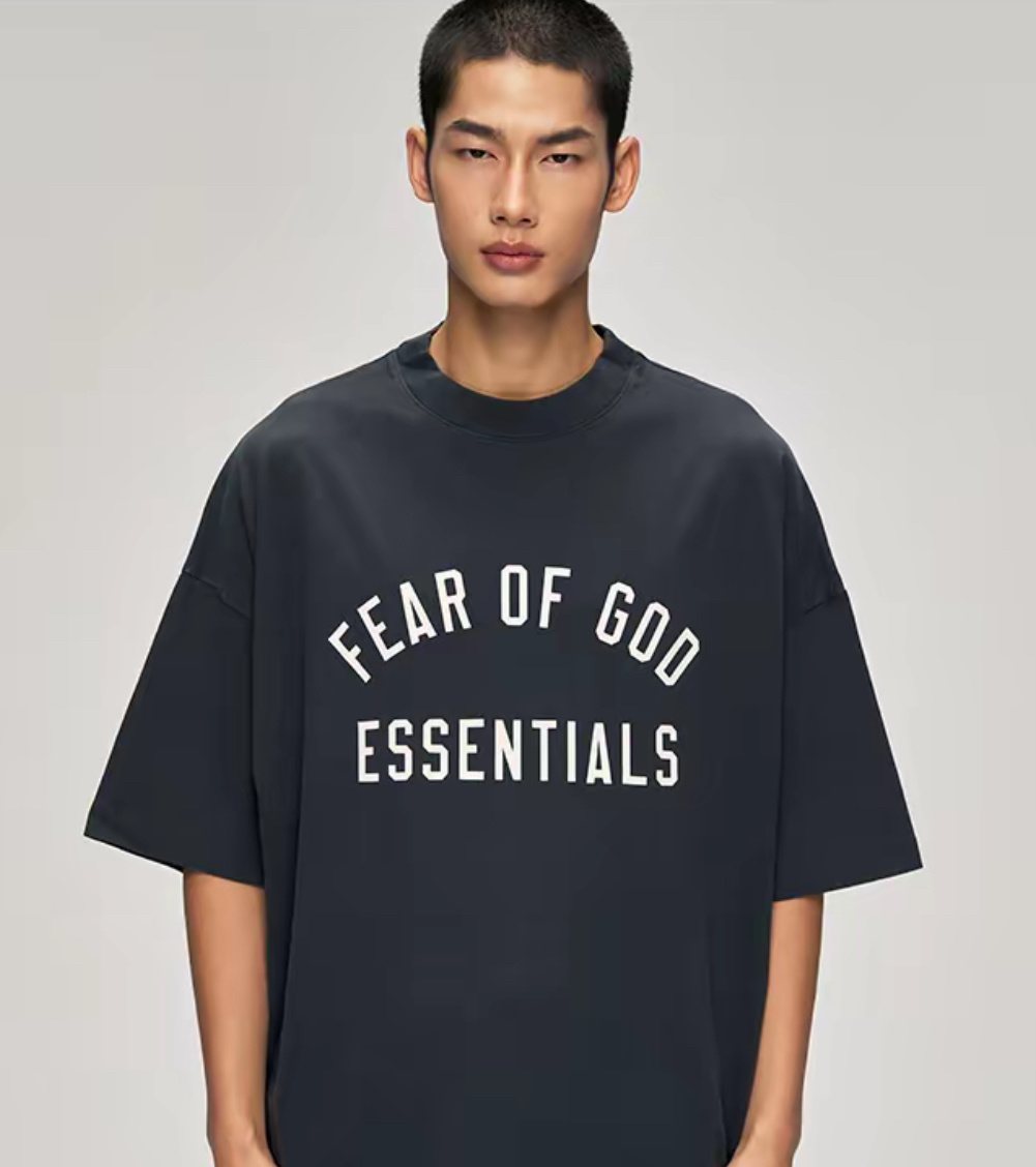 Fear of God Essentials Arched Logo Graphic T-Shirt — model
